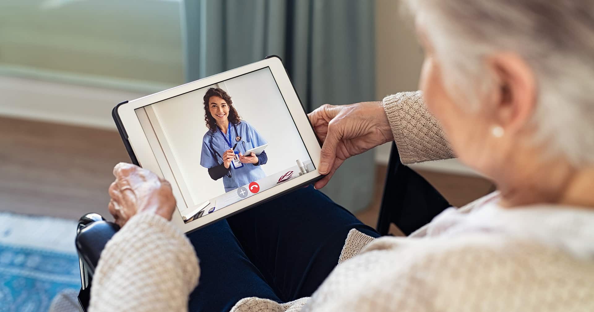 Doctor conducting a virtual care session on a tablet